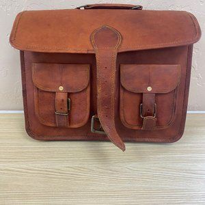 Vintage Leather Briefcase with buckles, straps and many pockets.